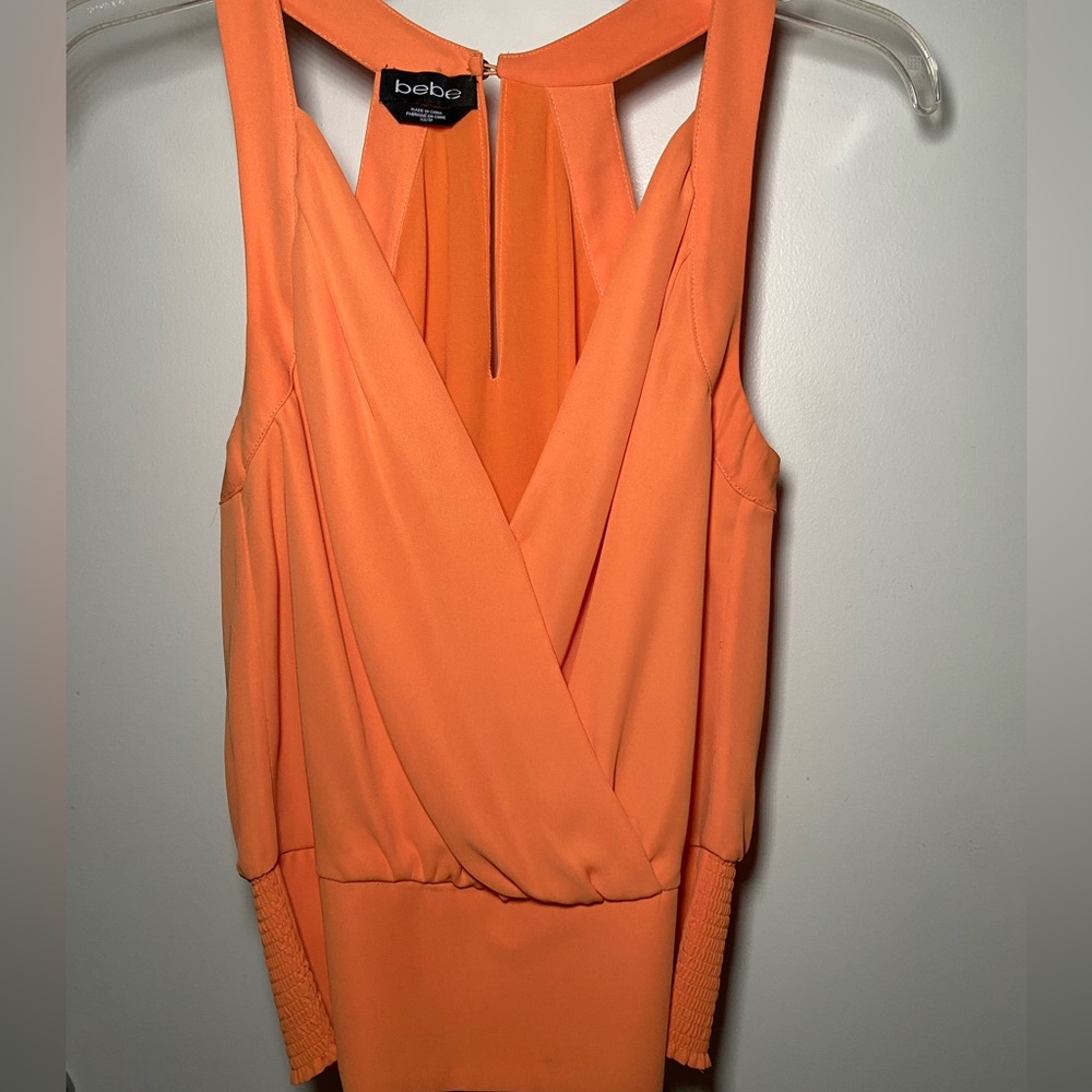 Orange plunging blouse with smock detail